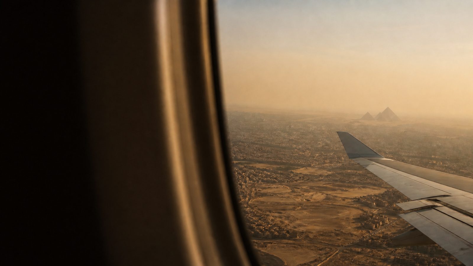 View of Cairo and the pyramids from an aircraft window on approach